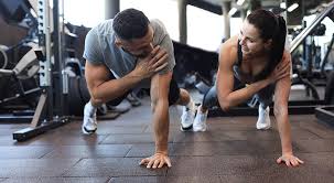 Toning Bingo Wings: Your Ultimate Guide to Sculpting Sleek Arms at the Gym 3 Fitness trainer demonstrating arm toning exercises Port Glasgow
